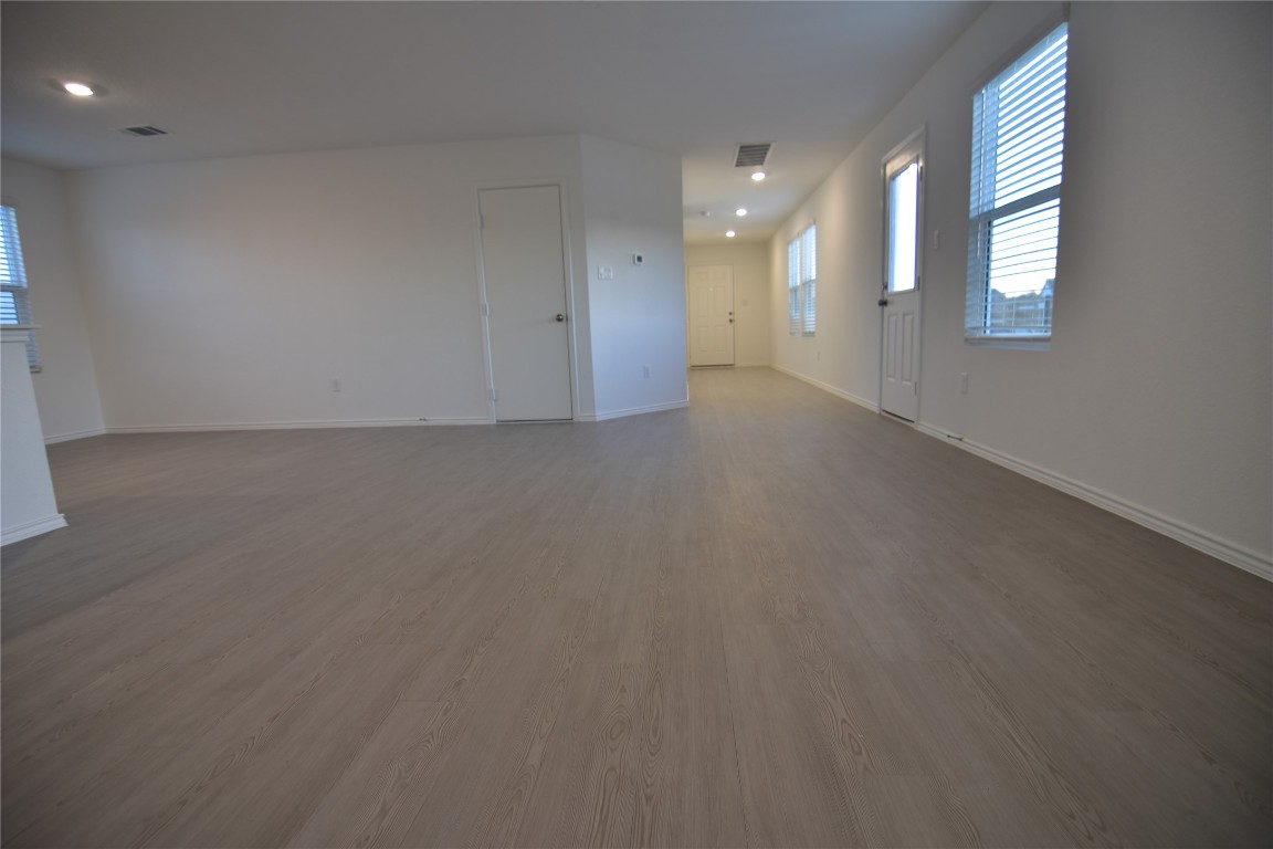 343 Keefer Kyle, TX 78640 - Photo 31 of 38 Unfurnished living room with light wood finished floors and recessed lighting