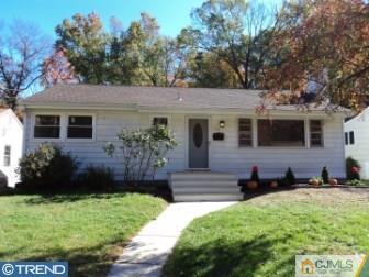 515 Sutherland Road Ewing, NJ 08618 - Photo 1 of 25 a front view of a house with a yard