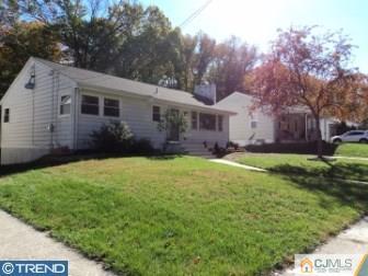 515 Sutherland Road Ewing, NJ 08618 - Photo 2 of 25 a view of a yard in front of a house with large tree