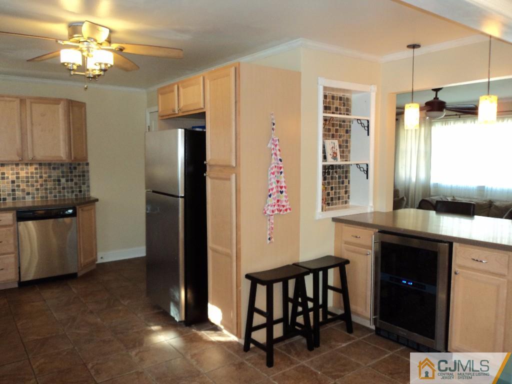 515 Sutherland Road Ewing, NJ 08618 - Photo 13 of 25 a kitchen with stainless steel appliances granite countertop a refrigerator and a stove top oven
