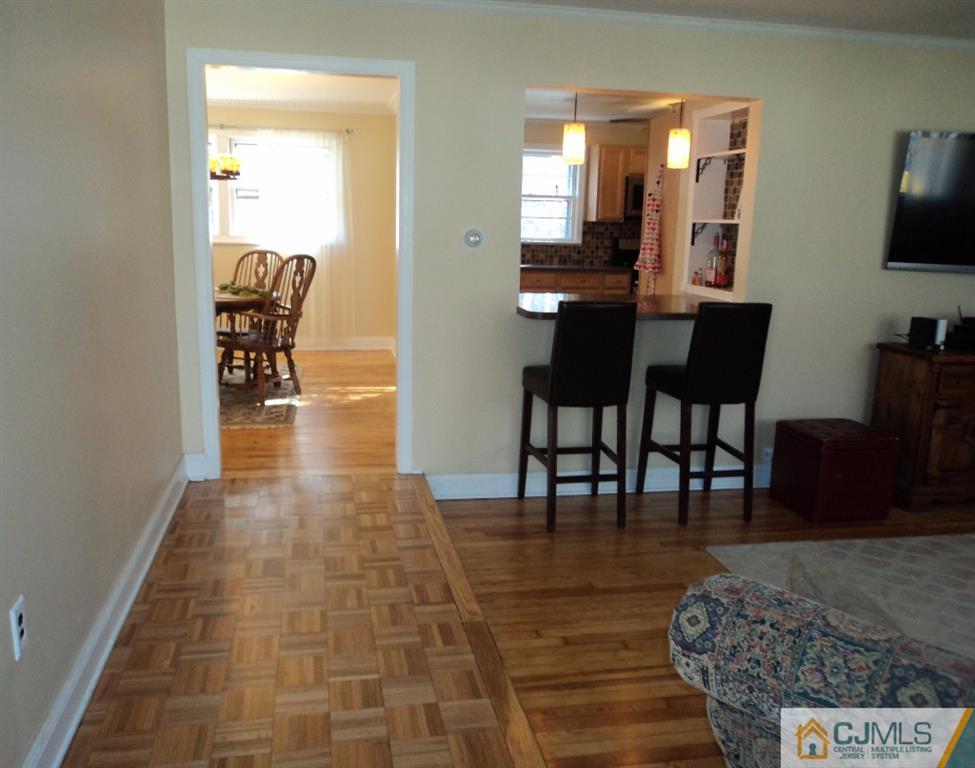 515 Sutherland Road Ewing, NJ 08618 - Photo 22 of 25 a dining room with furniture and wooden floor