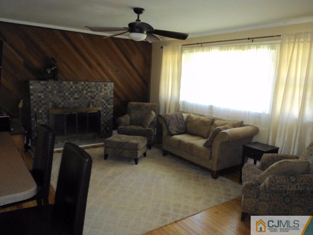 515 Sutherland Road Ewing, NJ 08618 - Photo 4 of 25 a living room with furniture and a fireplace