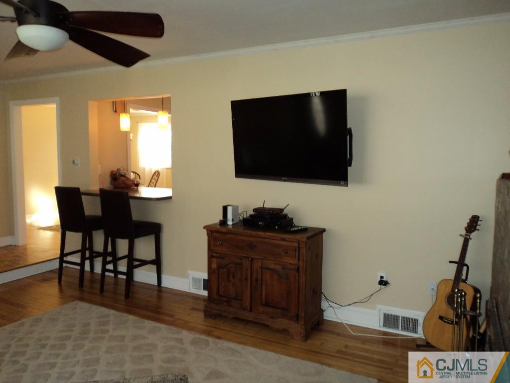 515 Sutherland Road Ewing, NJ 08618 - Photo 5 of 25 a living room with furniture and a flat screen tv