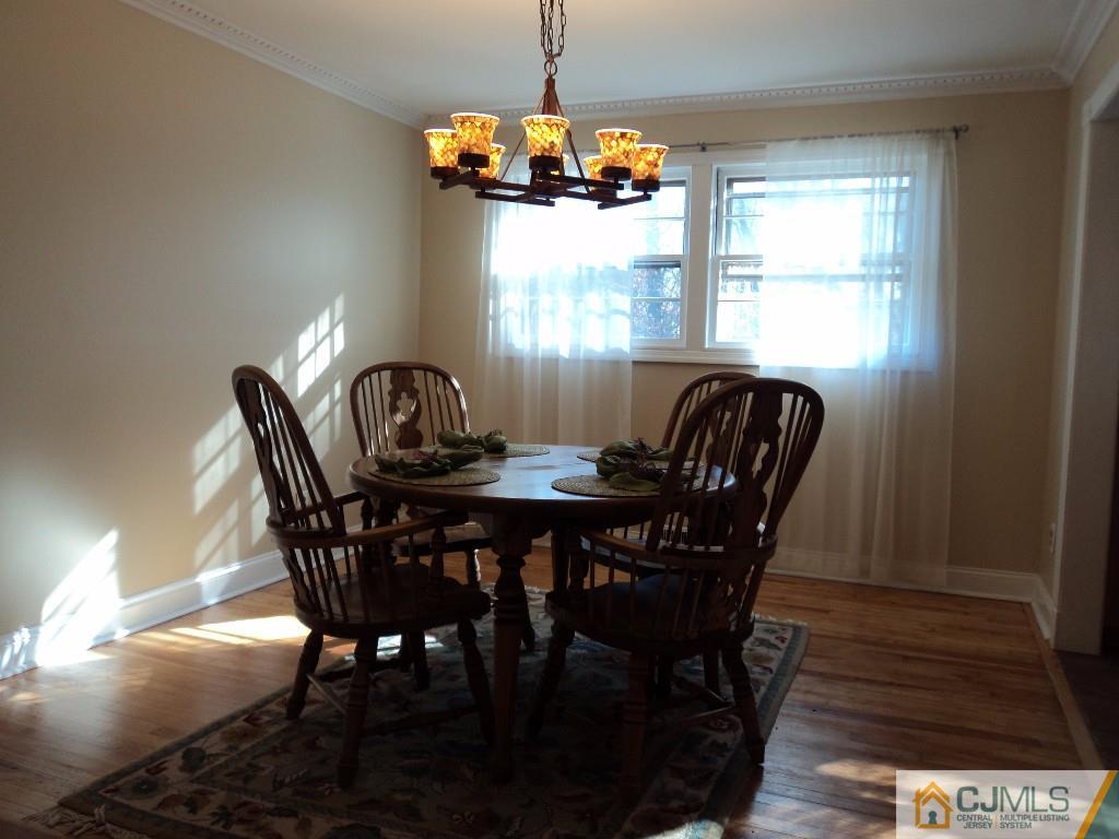 515 Sutherland Road Ewing, NJ 08618 - Photo 6 of 25 a dining room with furniture a chandelier and window