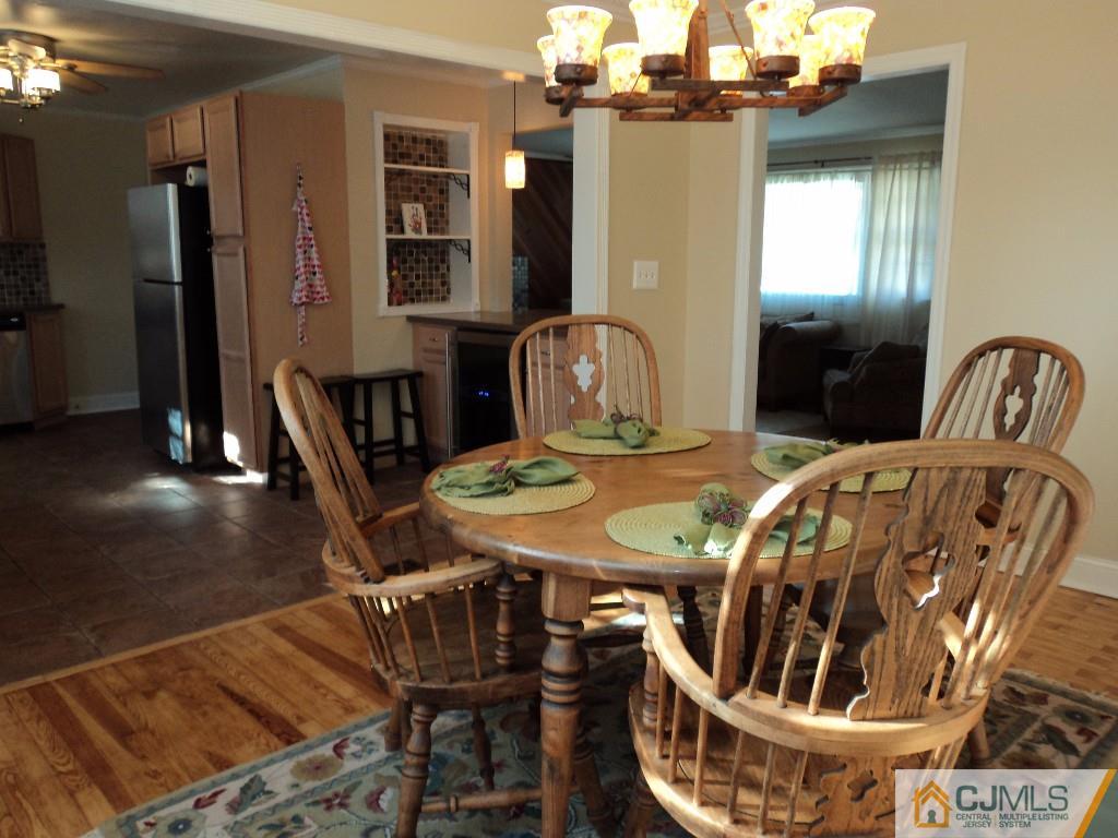 515 Sutherland Road Ewing, NJ 08618 - Photo 8 of 25 a view of a dining room with furniture and wooden floor