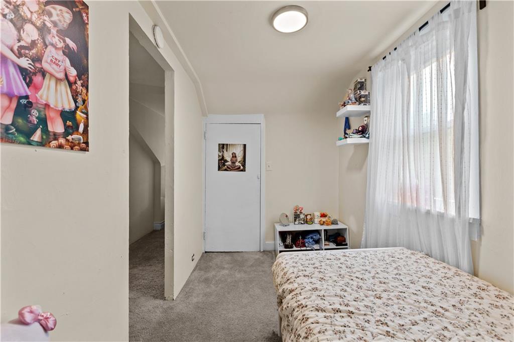 115 Frederick Street Mount Oliver, PA 15210 - Photo 21 of 35 a bedroom with a bed and a window