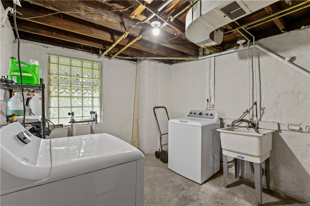115 Frederick Street Mount Oliver, PA 15210 - Photo 24 of 35 a bathroom with a sink and mirror with window
