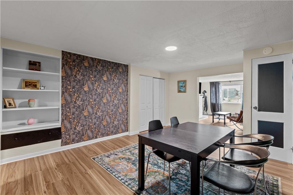 115 Frederick Street Mount Oliver, PA 15210 - Photo 4 of 35 a view of a dining room with furniture and wooden floor