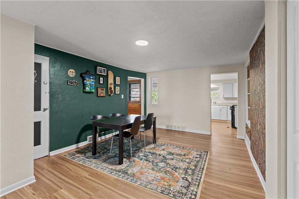 115 Frederick Street Mount Oliver, PA 15210 - Photo 5 of 35 a work room with furniture and wooden floor