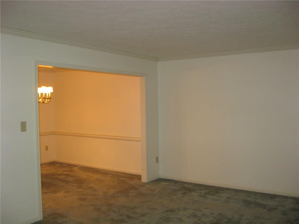 141 Shadow Ridge Drive Pittsburgh, PA 15238 - Photo 4 of 21 LIVING ROOM LEADING TO DINING ROOM W/ CHAIR RAIL & CROWN MOLDING