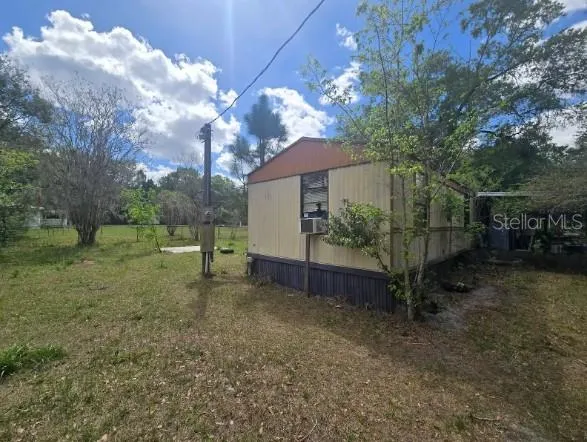 a backyard of a house with lots of green space