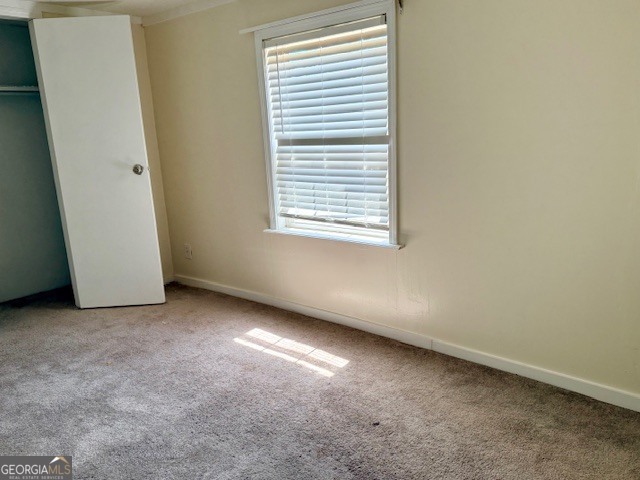 721 Ronnie Street Metter, GA 30439 - Photo 11 of 18 an empty room with a window