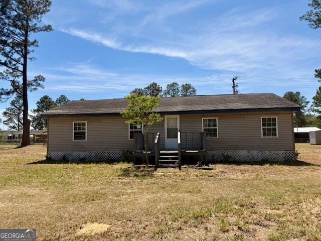 721 Ronnie Street Metter, GA 30439 - Photo 15 of 18 a front view of a house with a yard