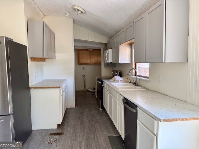 721 Ronnie Street Metter, GA 30439 - Photo 2 of 18 a kitchen with a sink a counter top space stainless steel appliances and cabinets