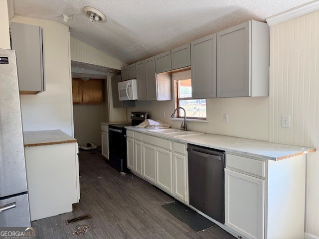 721 Ronnie Street Metter, GA 30439 - Photo 4 of 18 a kitchen with a sink cabinets stainless steel appliances and a window