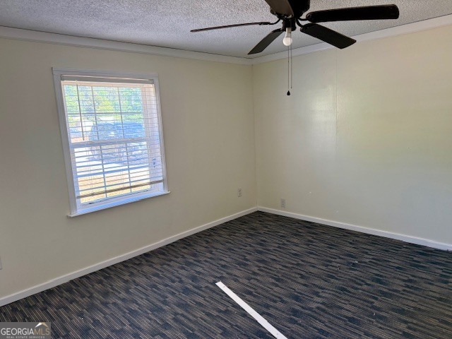 721 Ronnie Street Metter, GA 30439 - Photo 7 of 18 a view of an empty room with wooden floor and a window