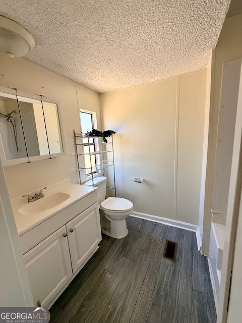 721 Ronnie Street Metter, GA 30439 - Photo 8 of 18 a bathroom with a sink a toilet and mirror