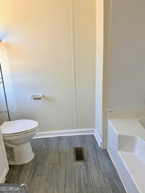 721 Ronnie Street Metter, GA 30439 - Photo 9 of 18 a bathroom with a toilet and a sink