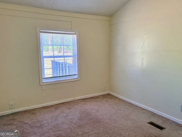 721 Ronnie Street Metter, GA 30439 - Photo 10 of 18 an empty room with a window