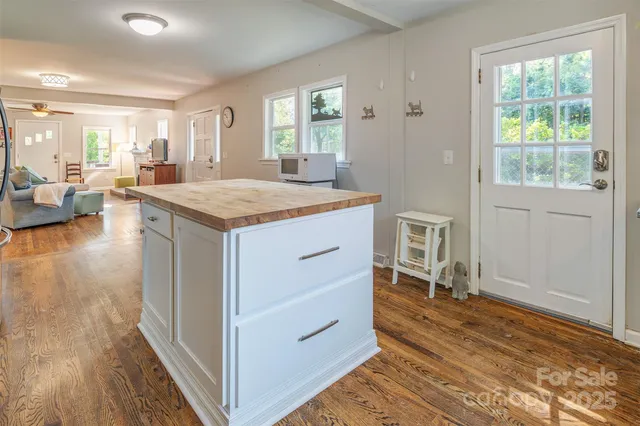 a living room with a stove and a window
