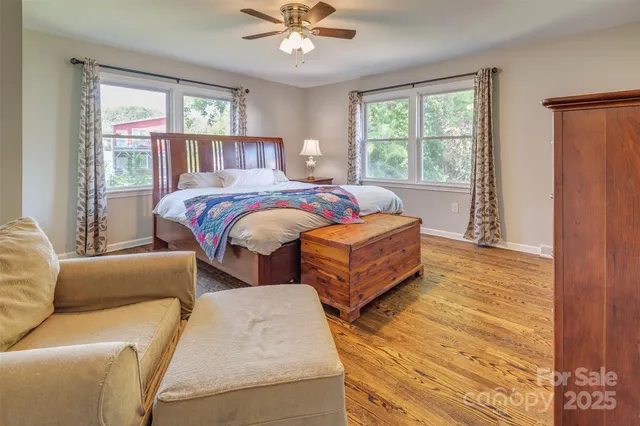 a bedroom with two beds and a window