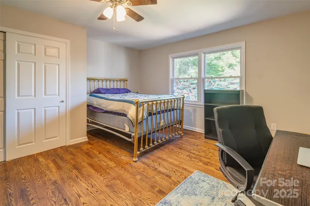 a bedroom with a bed and a chair