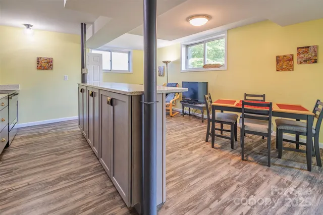 a view of a dining room with furniture and wooden floor