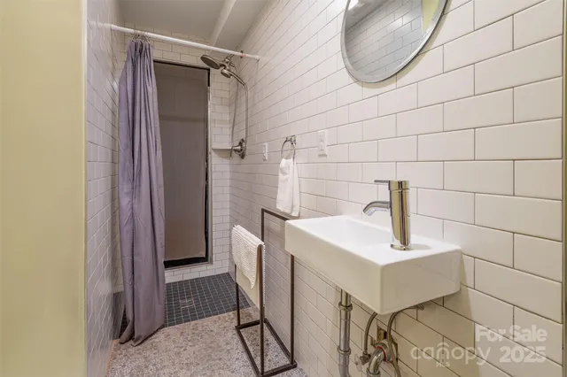 a view of a chair and table in backyard of the house