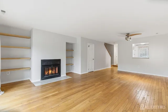 a view of empty room with a fireplace
