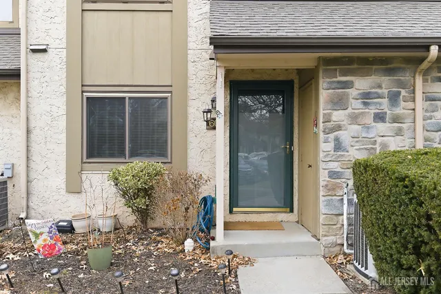 a front view of a house with an outdoor space