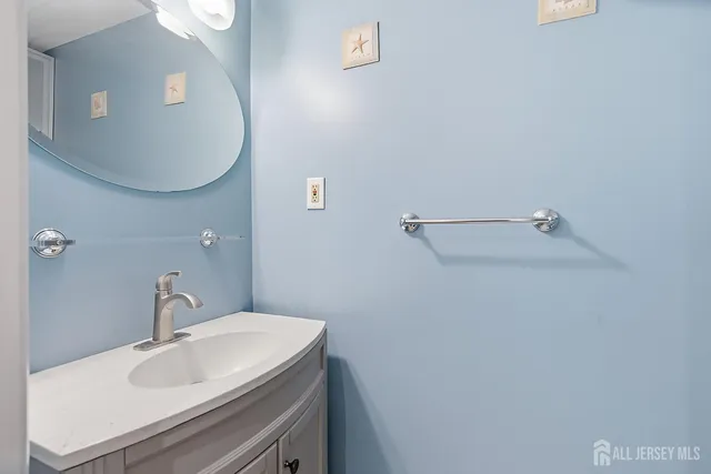a bathroom with a sink and mirror