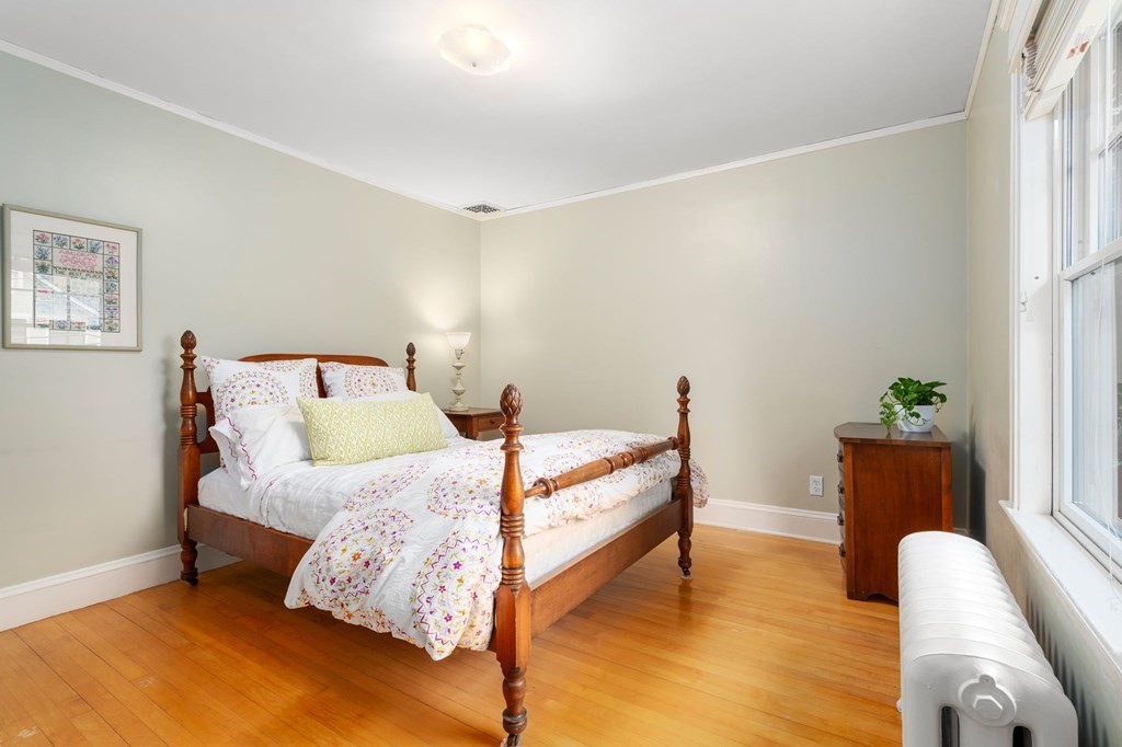 66 Stevens Road Needham, MA 02492 - Photo 18 of 33 a bedroom with bed and wooden floor