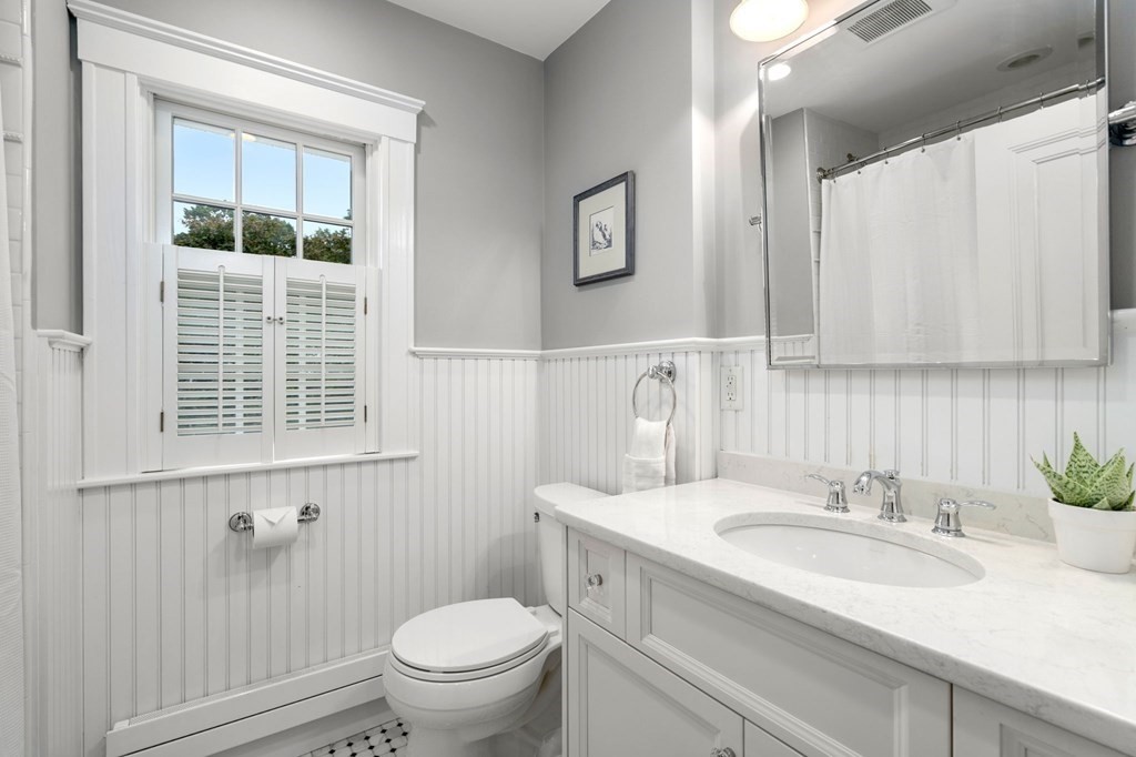 66 Stevens Road Needham, MA 02492 - Photo 21 of 33 a bathroom with a granite countertop sink toilet and shower