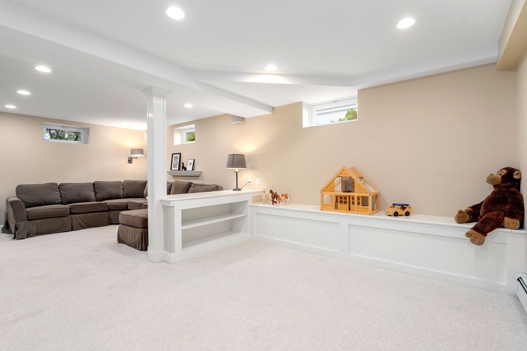 66 Stevens Road Needham, MA 02492 - Photo 23 of 33 a living room with furniture and white walls