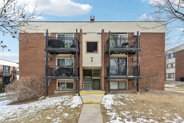 a view of a building with a door and balcony