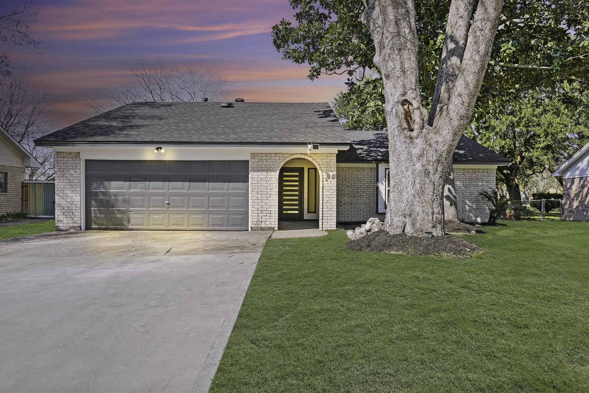 13102 Maxim Drive Houston, TX 77065 - Photo 1 of 45 a front view of a house with a garden and yard
