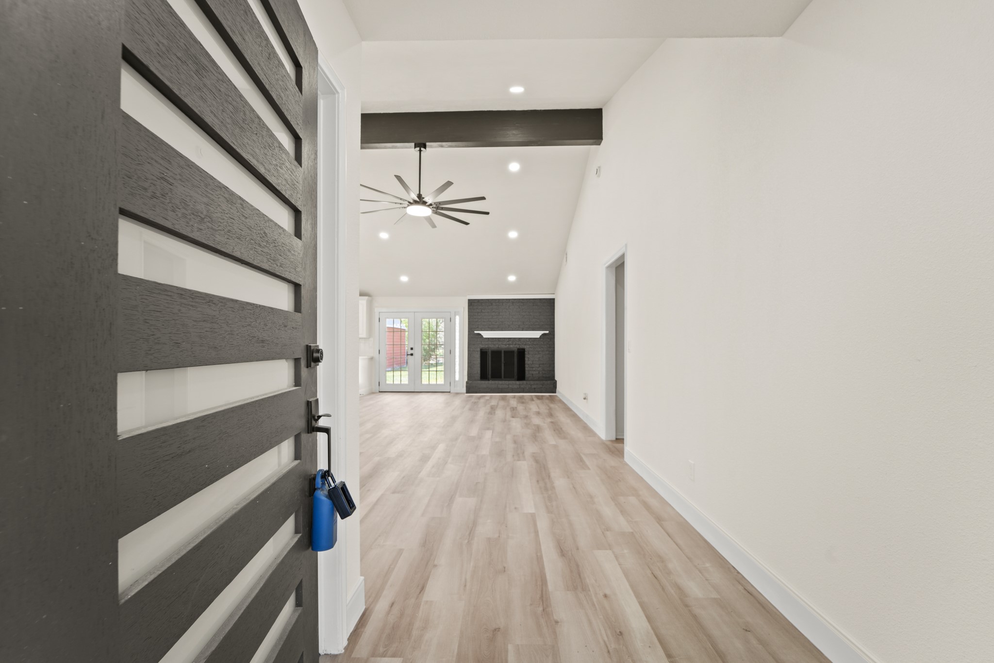 13102 Maxim Drive Houston, TX 77065 - Photo 15 of 45 a view of empty room with wooden floor and fan