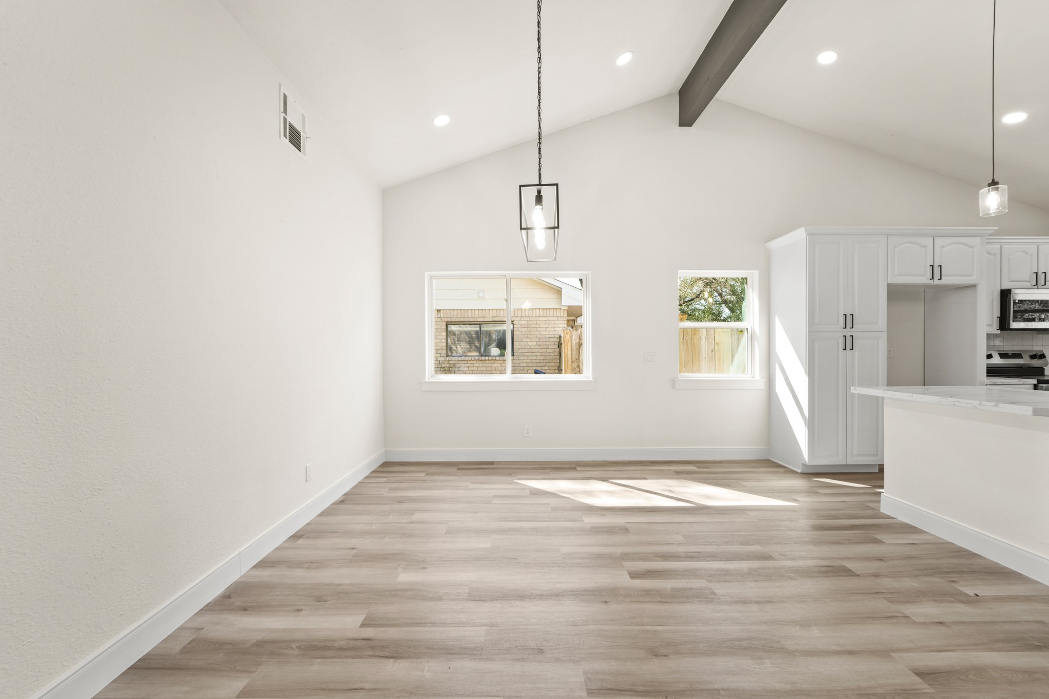 13102 Maxim Drive Houston, TX 77065 - Photo 18 of 45 a view of an empty room with window and wooden floor