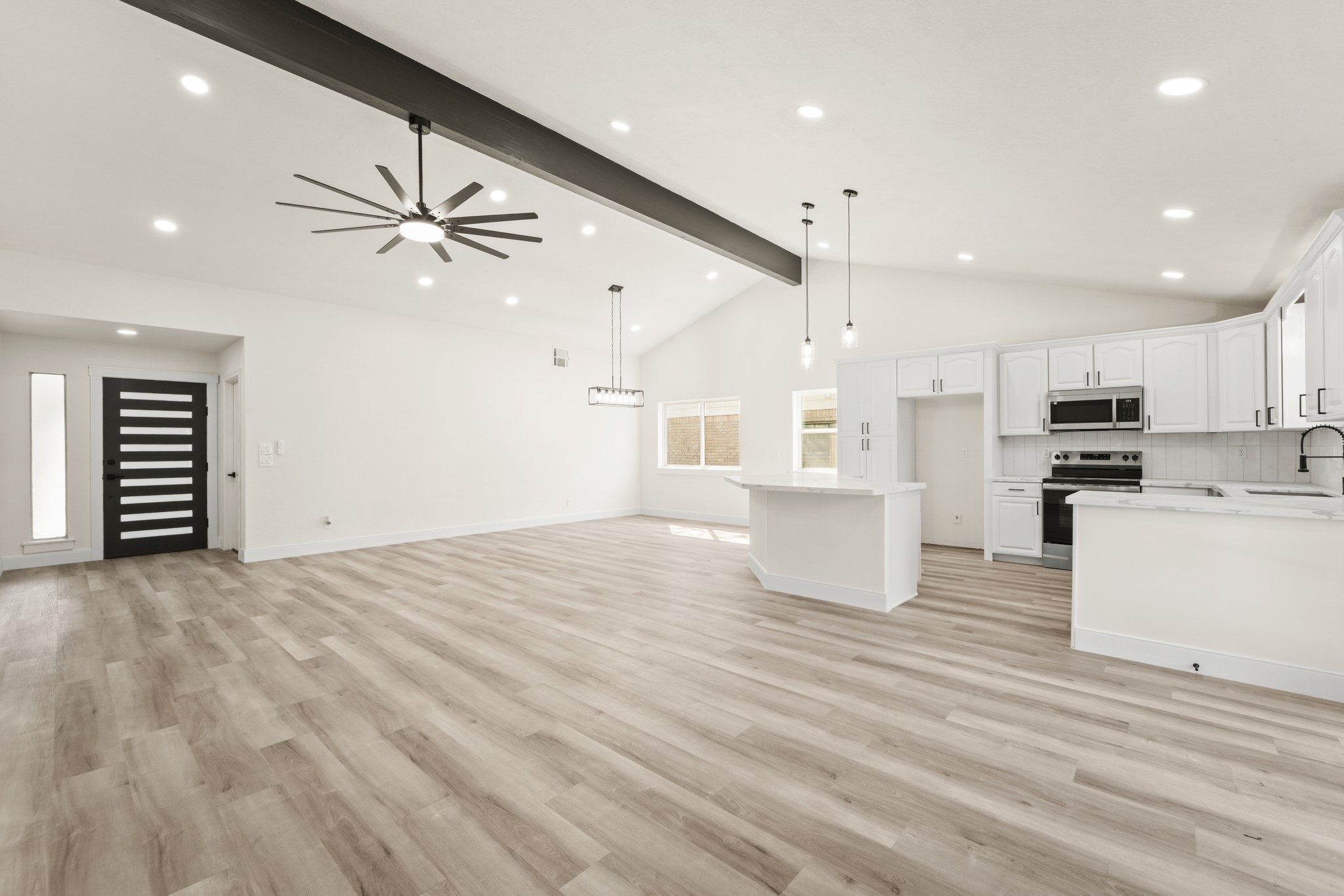 13102 Maxim Drive Houston, TX 77065 - Photo 2 of 45 a view of kitchen and kitchen with stainless steel appliances wooden floor