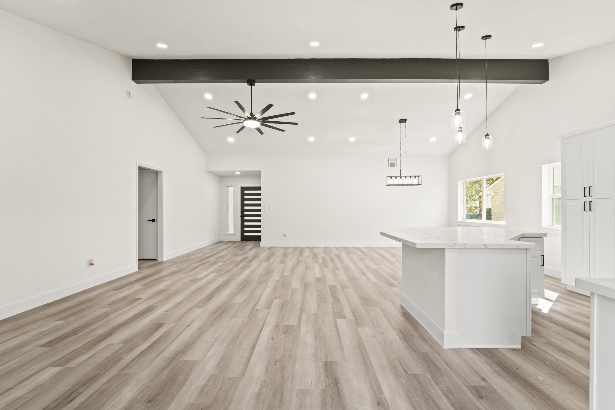 13102 Maxim Drive Houston, TX 77065 - Photo 23 of 45 a view of an empty room with window and wooden floor