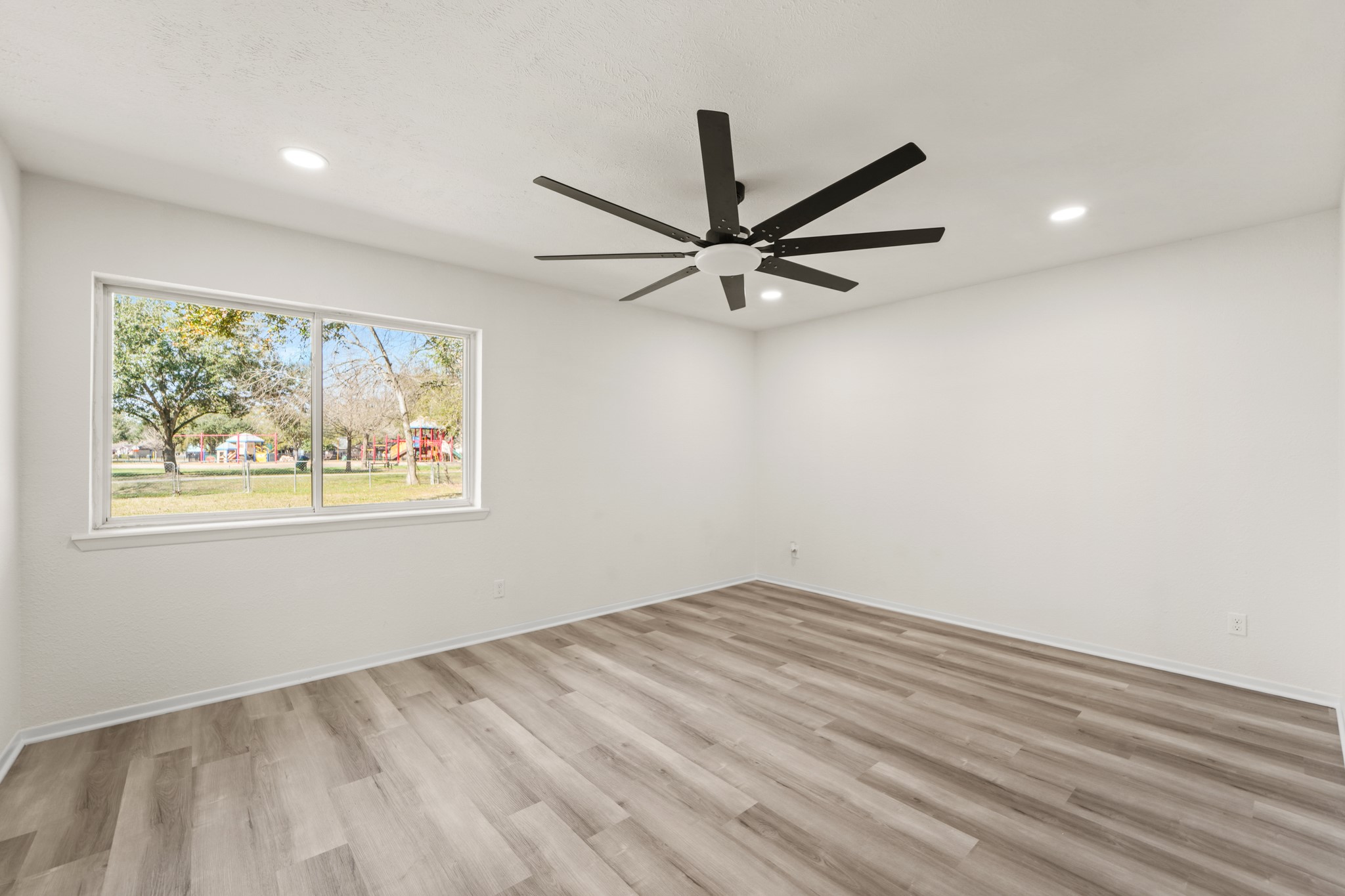 13102 Maxim Drive Houston, TX 77065 - Photo 26 of 45 wooden floor in an empty room with a window