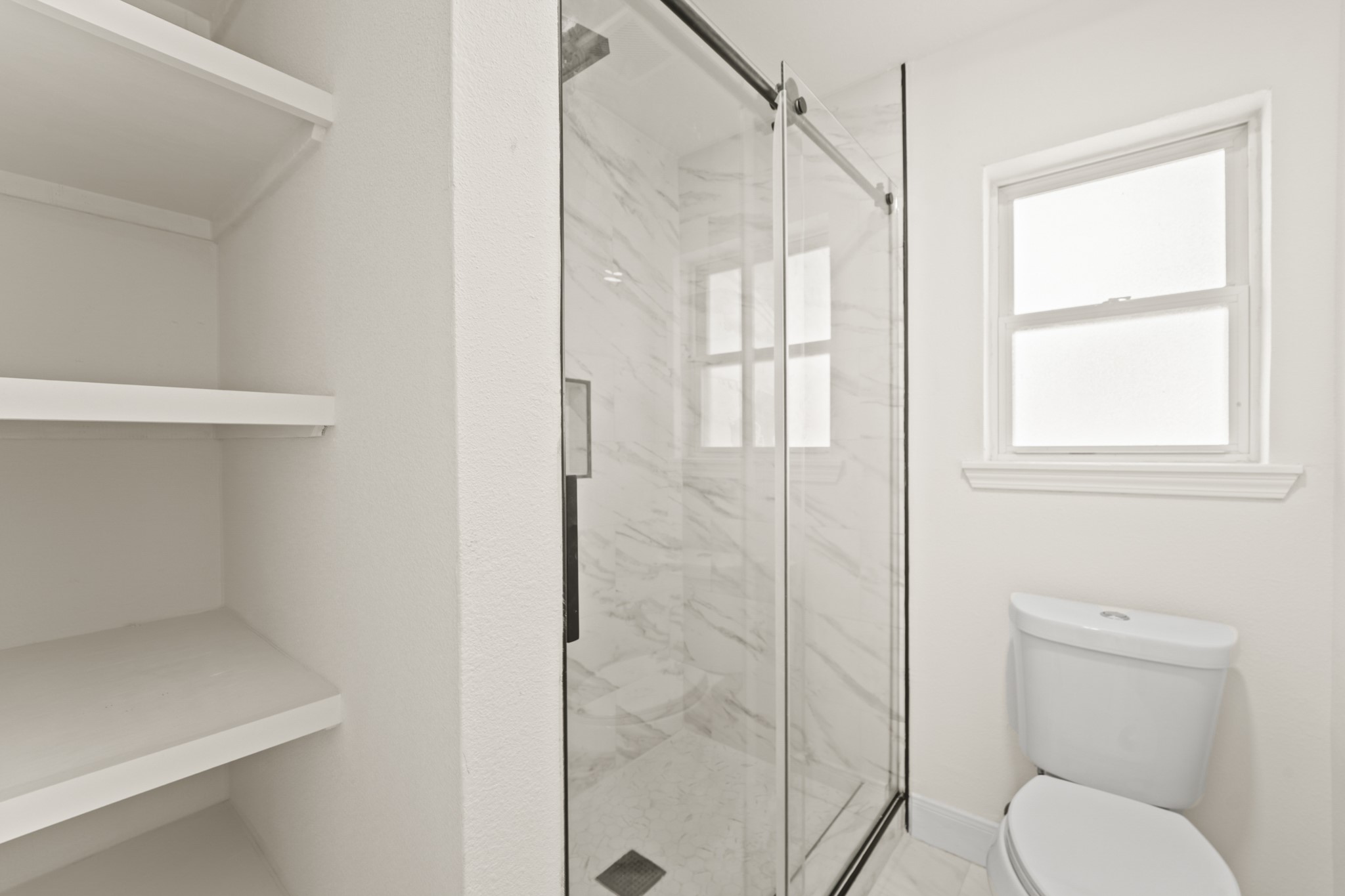 13102 Maxim Drive Houston, TX 77065 - Photo 27 of 45 a bathroom with a toilet and a shower