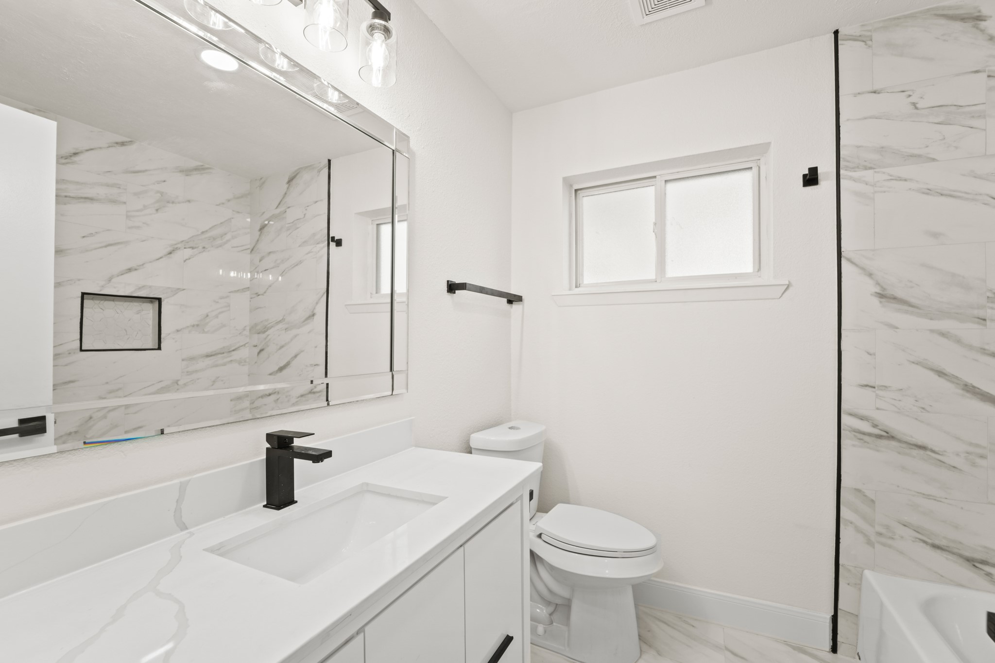 13102 Maxim Drive Houston, TX 77065 - Photo 28 of 45 a bathroom with a sink toilet and shower