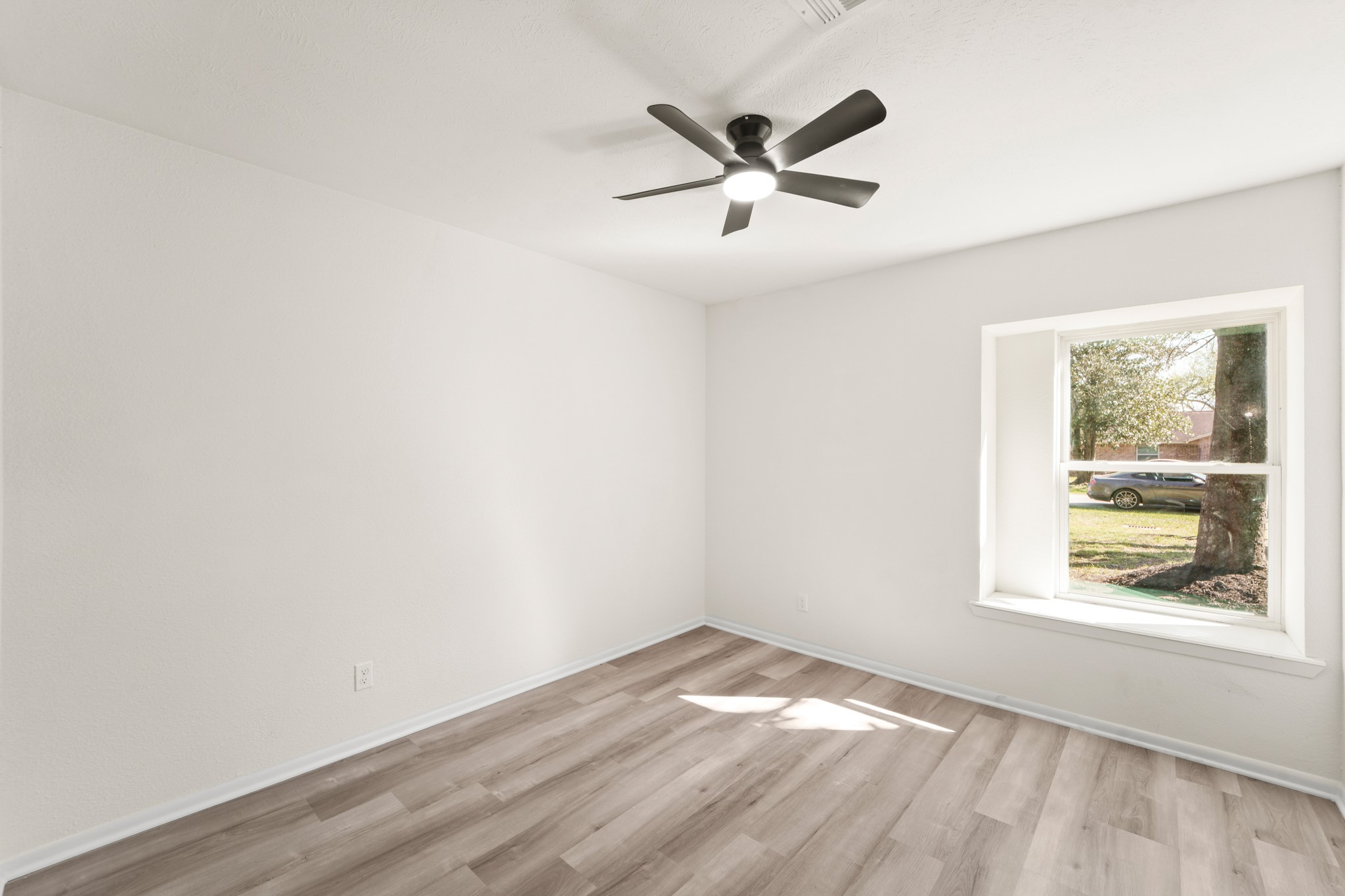 13102 Maxim Drive Houston, TX 77065 - Photo 31 of 45 wooden floor in an empty room with a window