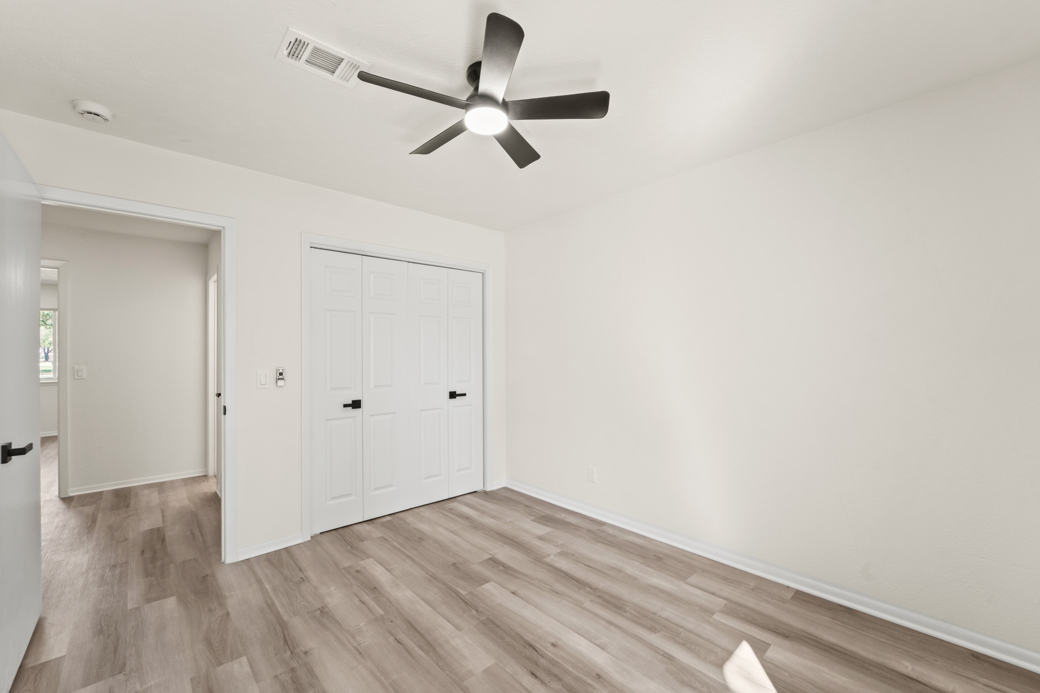 13102 Maxim Drive Houston, TX 77065 - Photo 33 of 45 a view of empty room with wooden floor