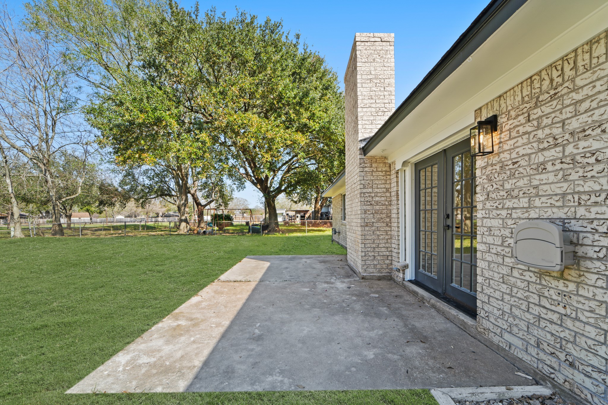 13102 Maxim Drive Houston, TX 77065 - Photo 37 of 45 a view of a yard with brick walls