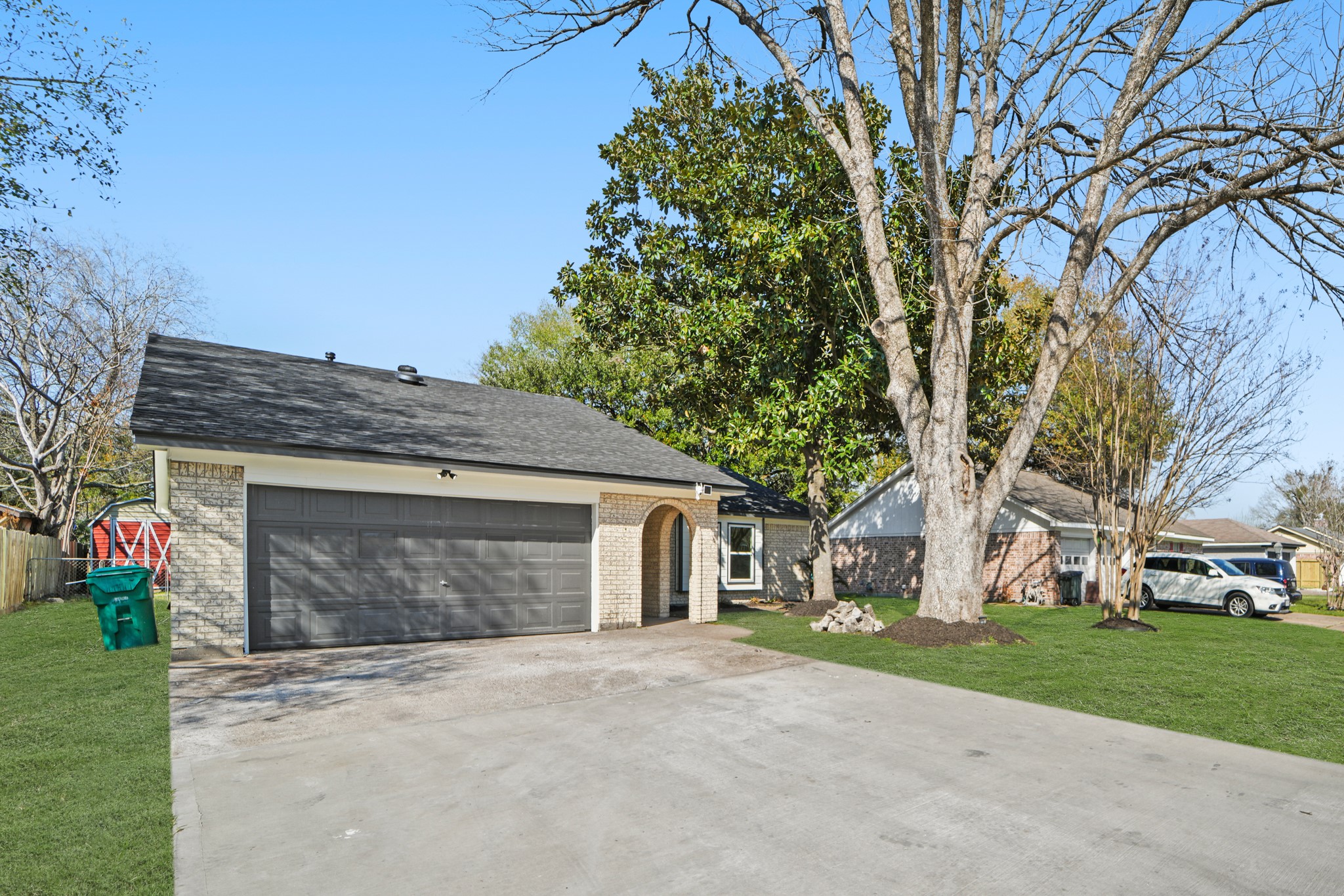 13102 Maxim Drive Houston, TX 77065 - Photo 45 of 45 a front view of a house with a garden and trees