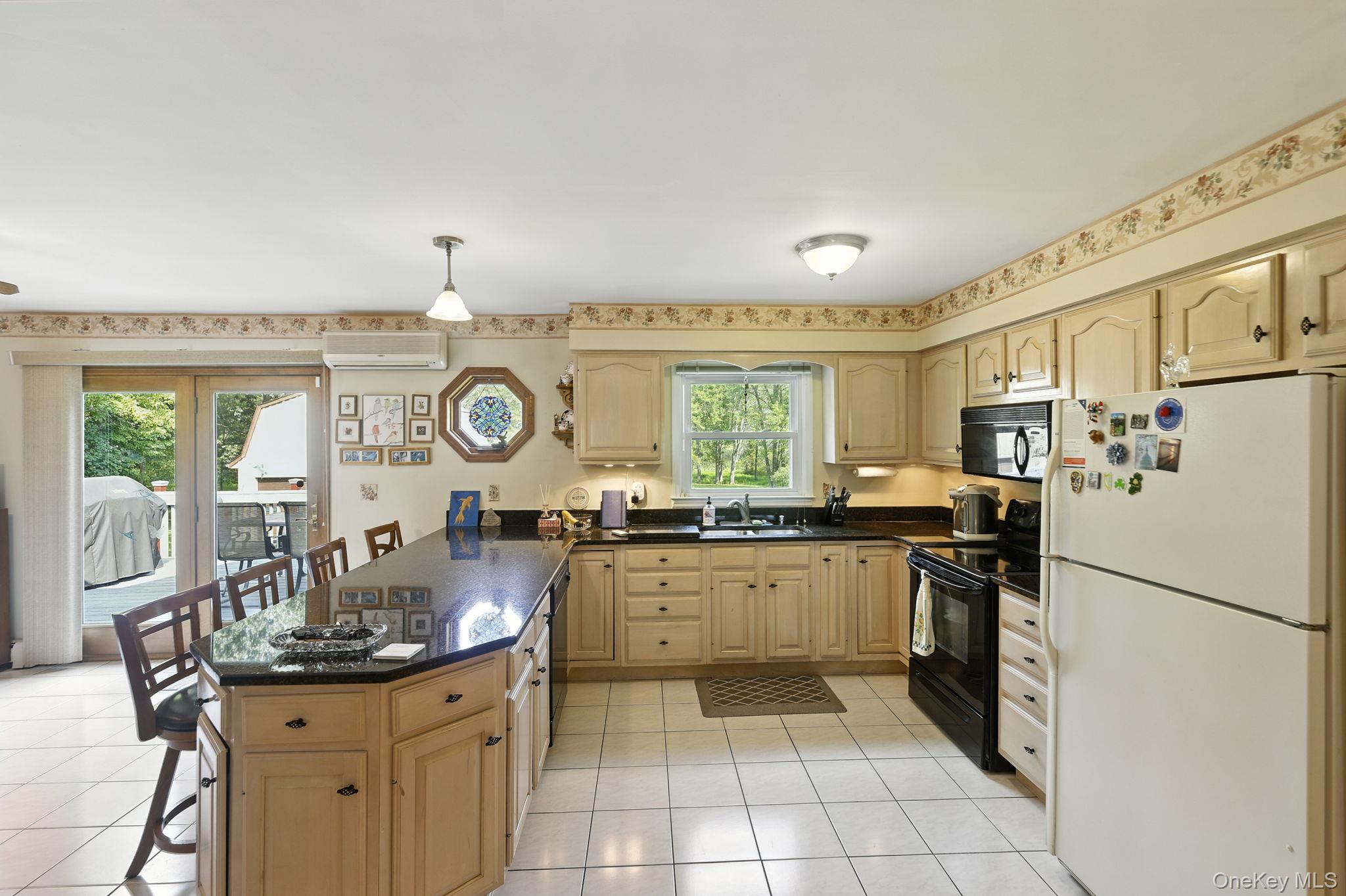 220 North Parliman Road LaGrangeville, NY 12540 - Photo 13 of 41 a kitchen with stainless steel appliances granite countertop a sink stove and refrigerator
