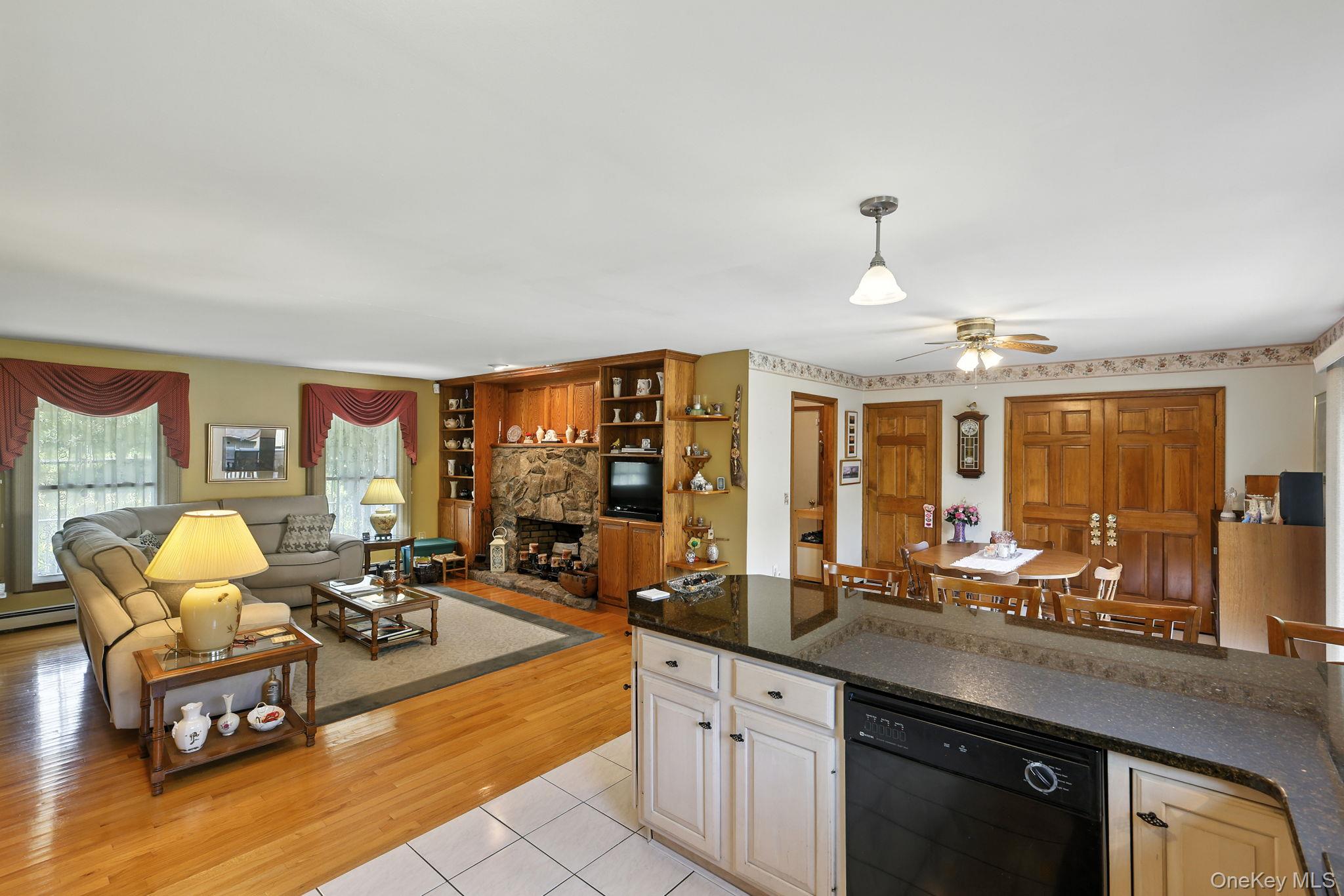 220 North Parliman Road LaGrangeville, NY 12540 - Photo 14 of 41 a very nice looking living room with a large window and dining table
