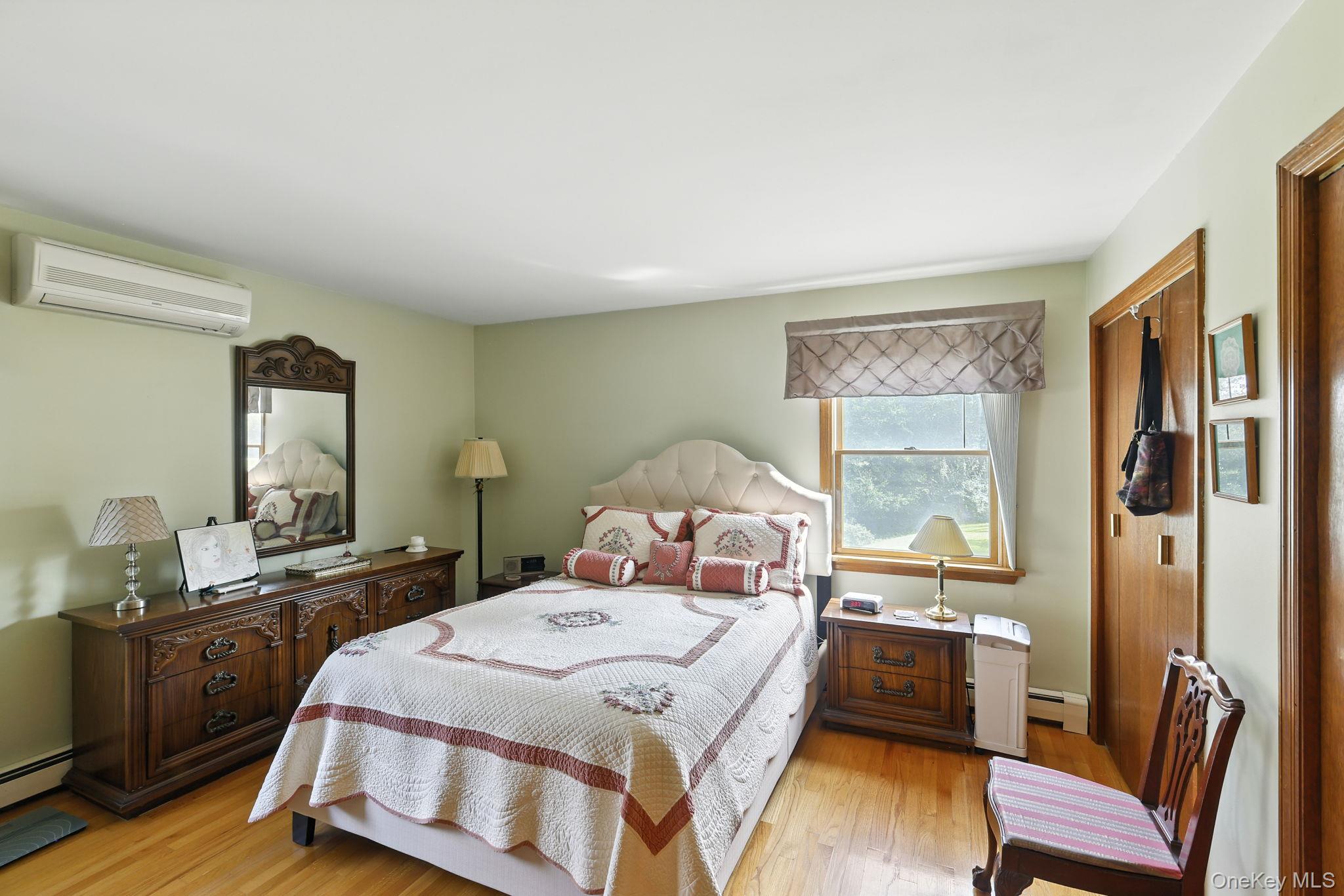 220 North Parliman Road LaGrangeville, NY 12540 - Photo 16 of 41 a bed room with a bed and a chair